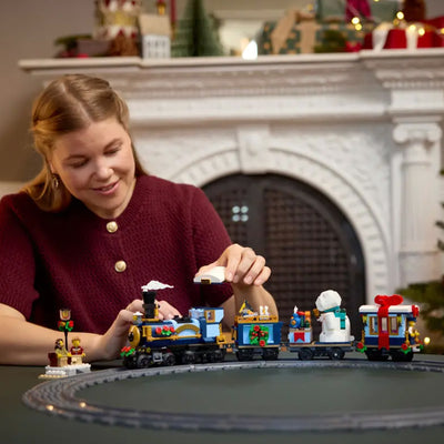 Treno espresso festivo fotografia donna che costruisce il set lego